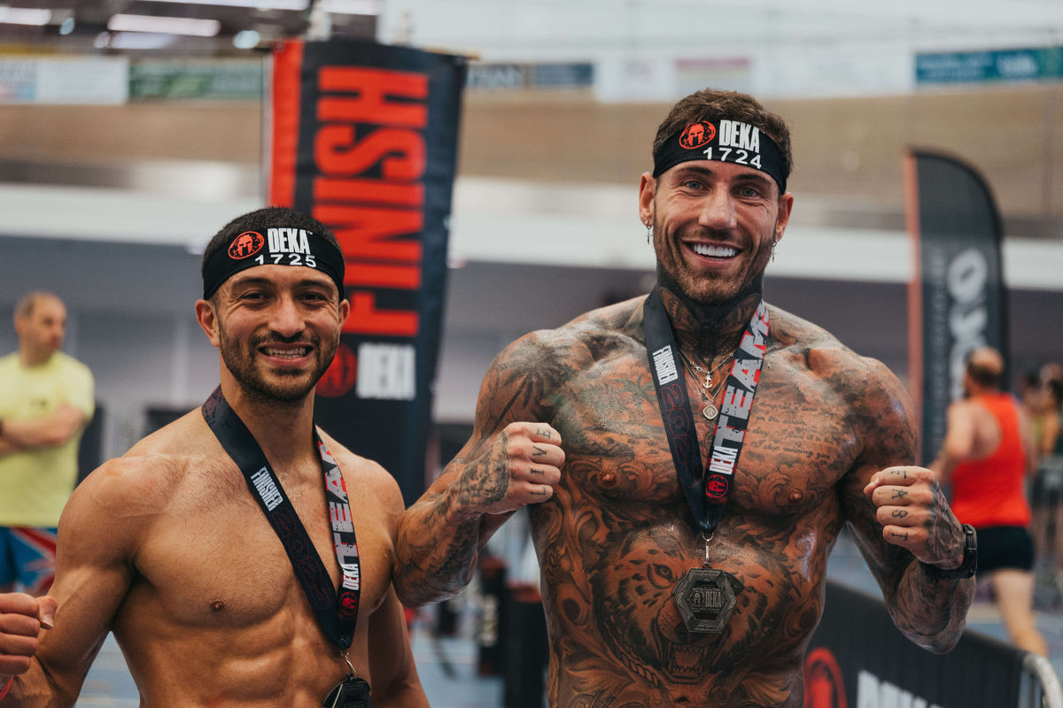 Two athletes celebrating at the finish line